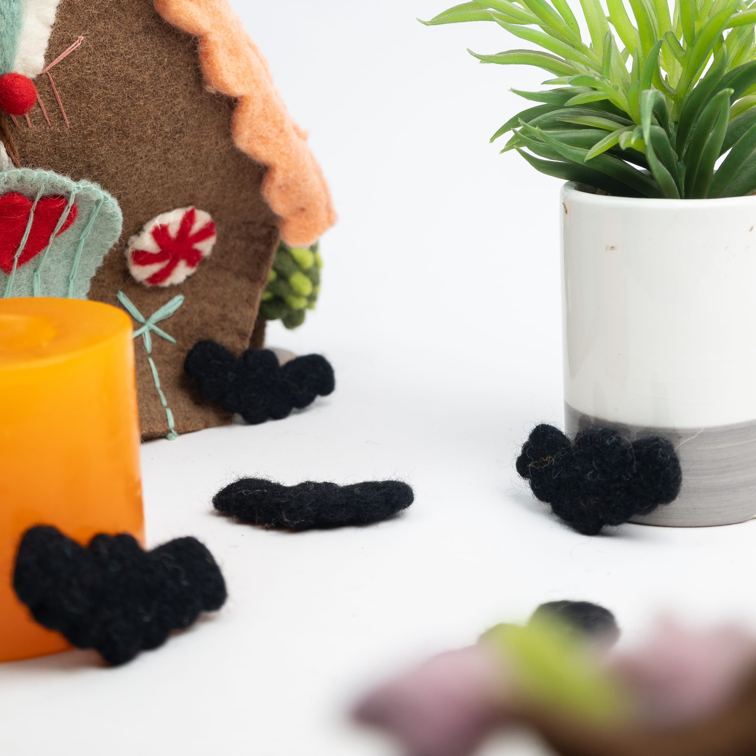 Felt Halloween decorations including bats for seasonal retail collections.